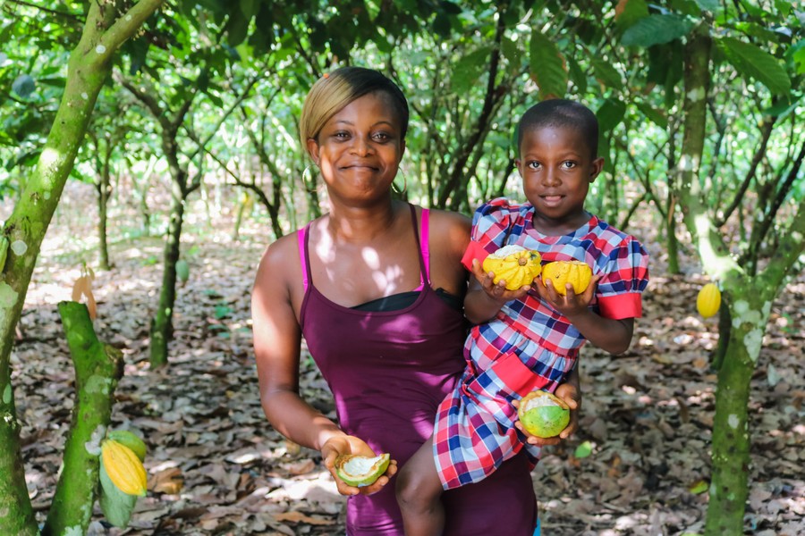 Mother and daughter in a cocoa field in Ghana
